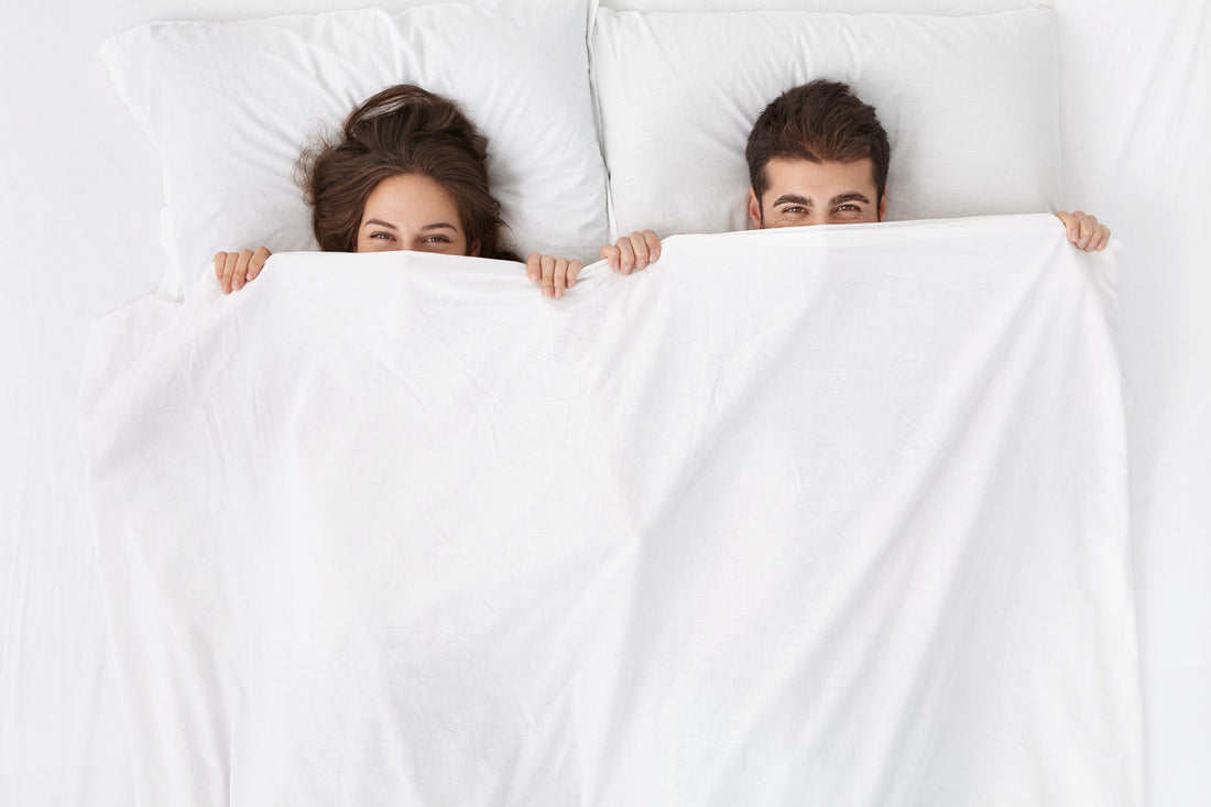 Married couple lying in bed. Sleep and Libido